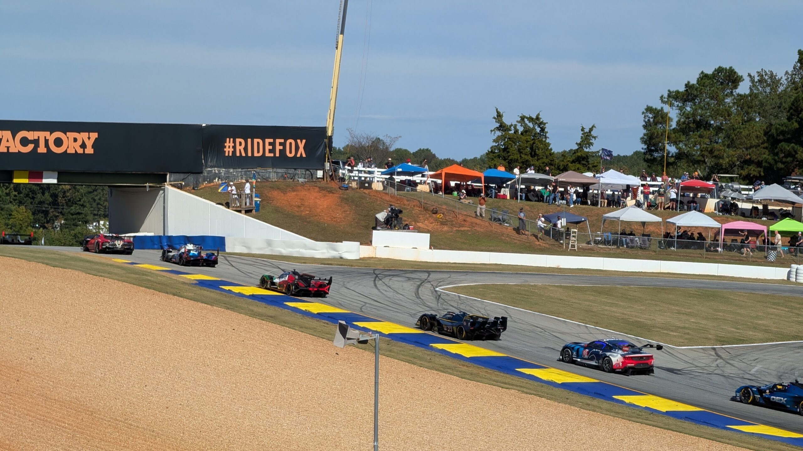Cars racing at Petit Le Mans