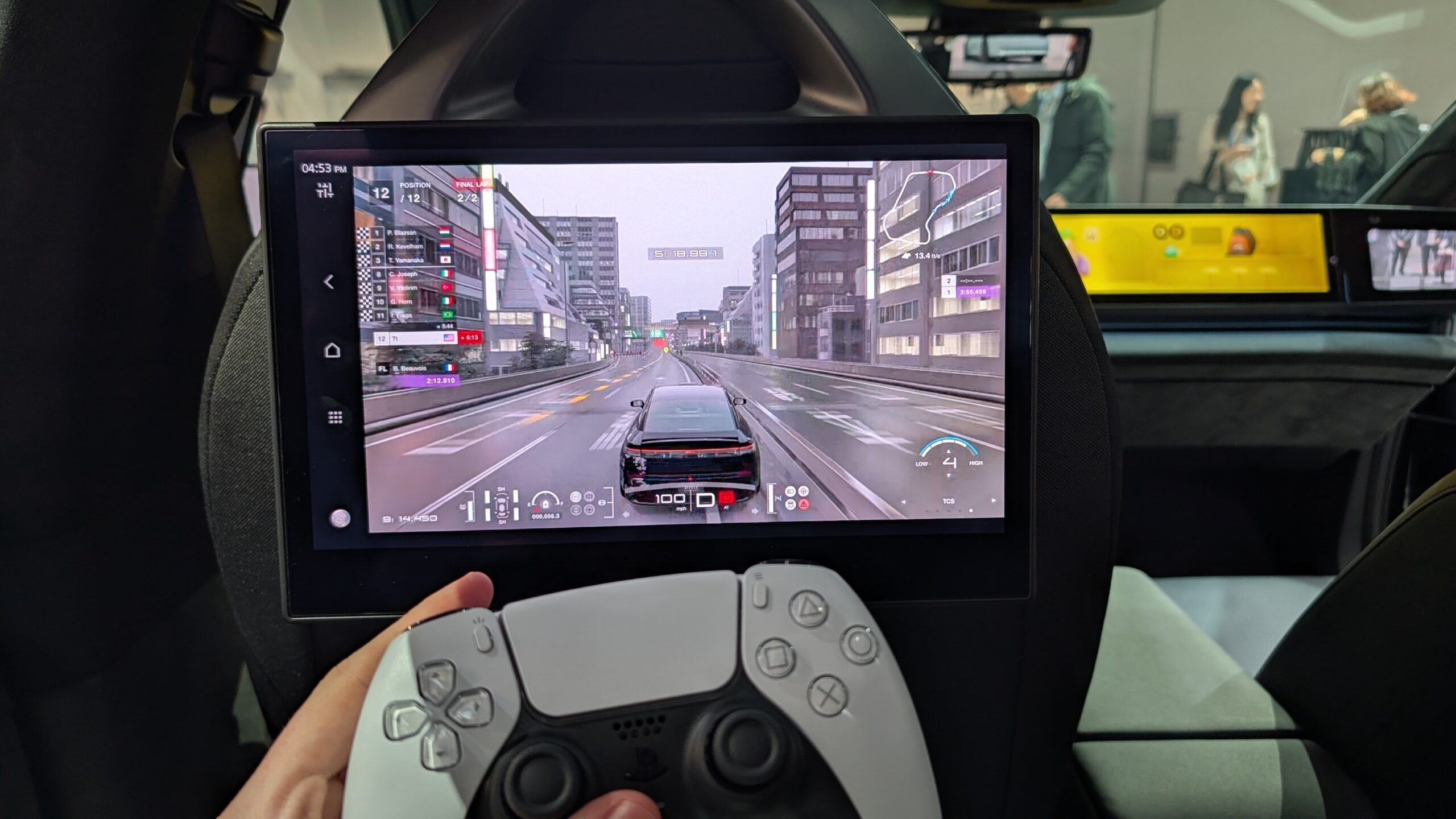 Playstation running in the back of a Sony AFEELA