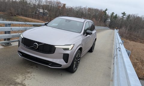 Tilted 3/4 view of a Volvo XC90 on a bridge