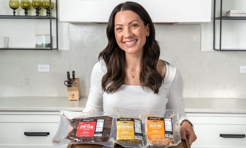Woman holding true nature meats