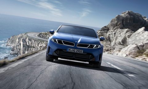 Front view of a blue BMW i3 on the road