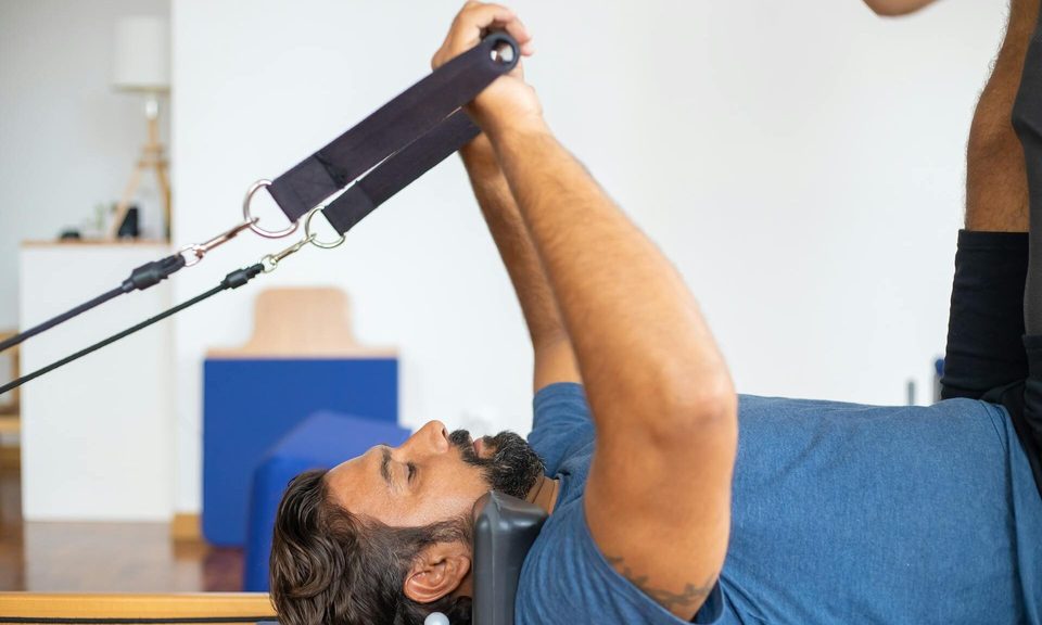 man doing Pilates workout