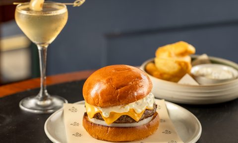 cheeseburger on plate with martini