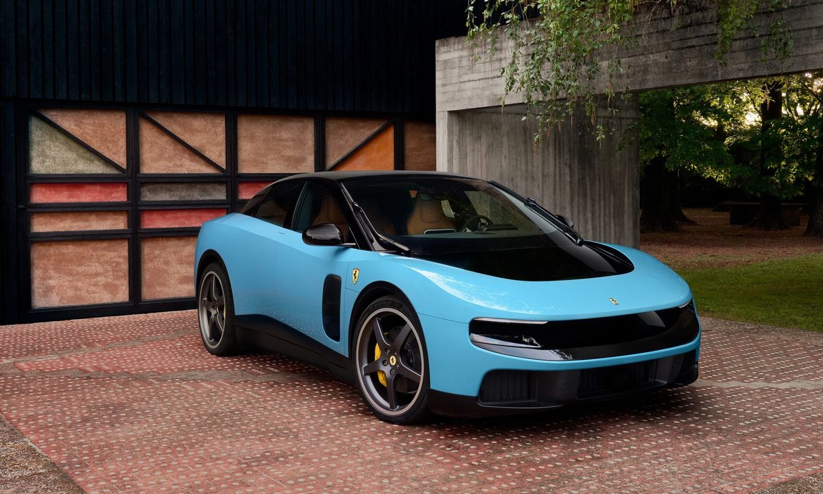 A blue Ferrari Luce on a driveway