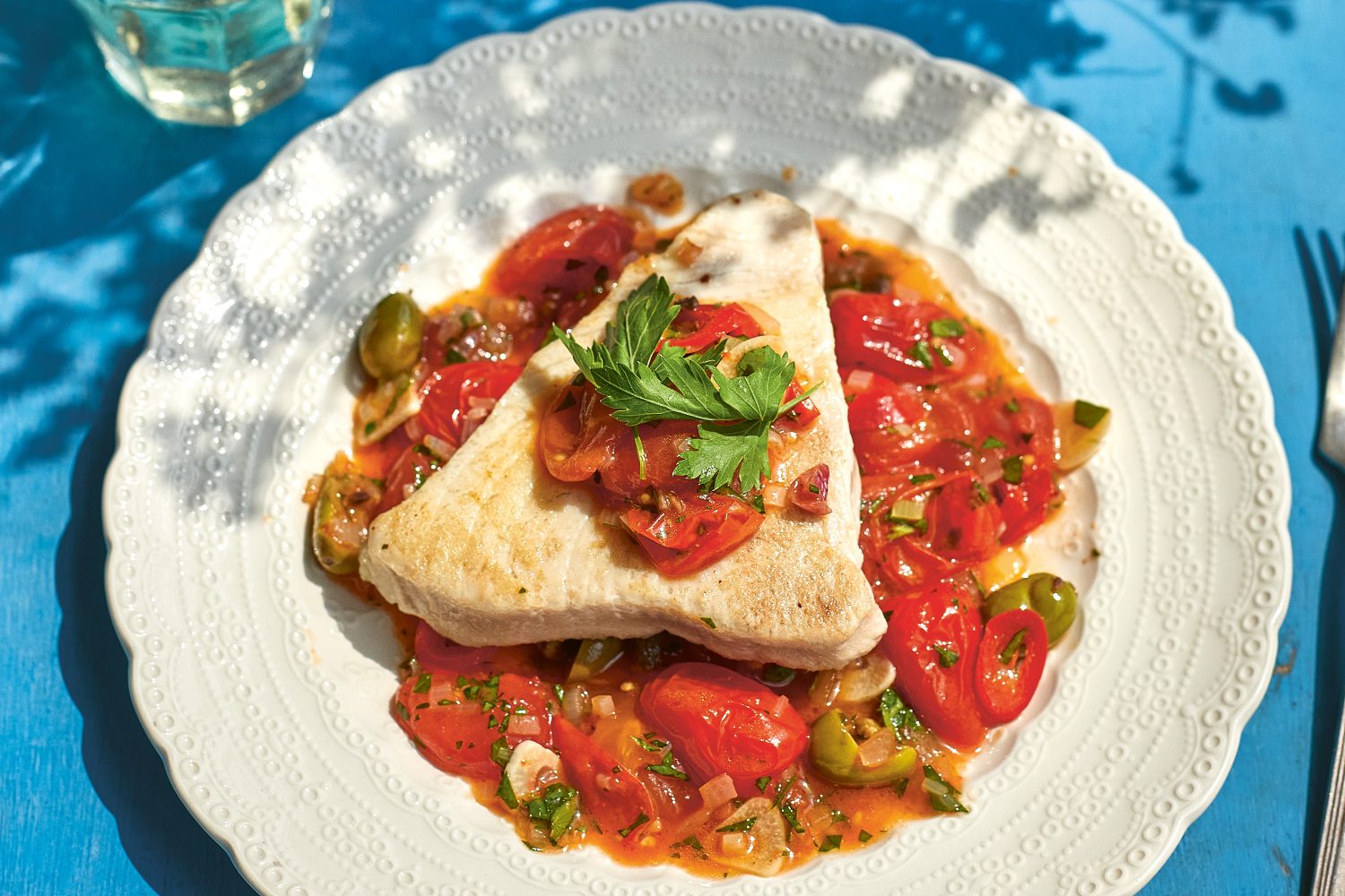 Tuna steaks in tomato sauce.