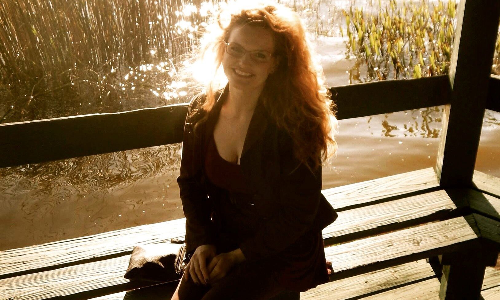 Steph Green sitting on wooden bench