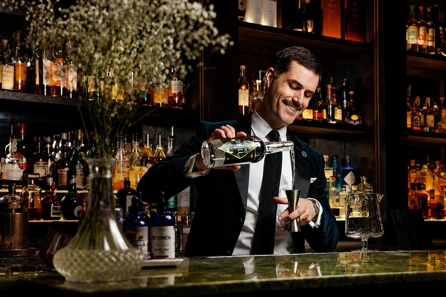 bartender james grant makes a drink