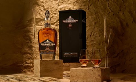 a bottle of The Boss Hog XIII: The Golden Pharaoh and two glasses