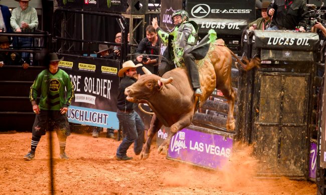 Rider representing the Austin Gamblers riding a bull at PBR Rattler Days Event 2026