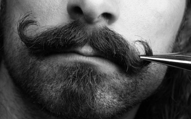 Close-up of a man with a handlebar mustache