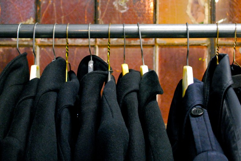 men's outerwear on coat rack