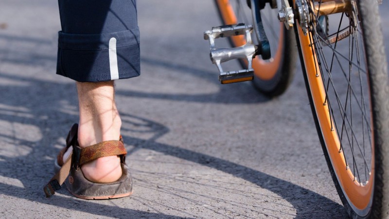 commuter pant, mountain khakis, rolled up pant leg on bicycle