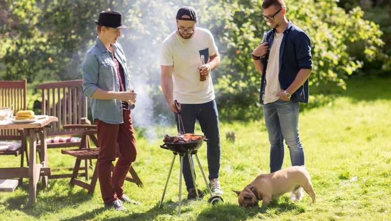 Friends grilling outdoors
