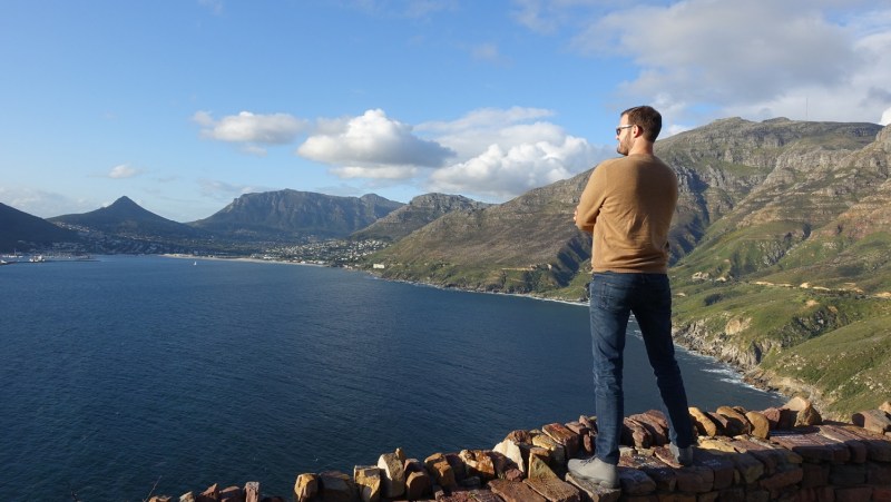 the points guy, man standing on cliff overlooking bay