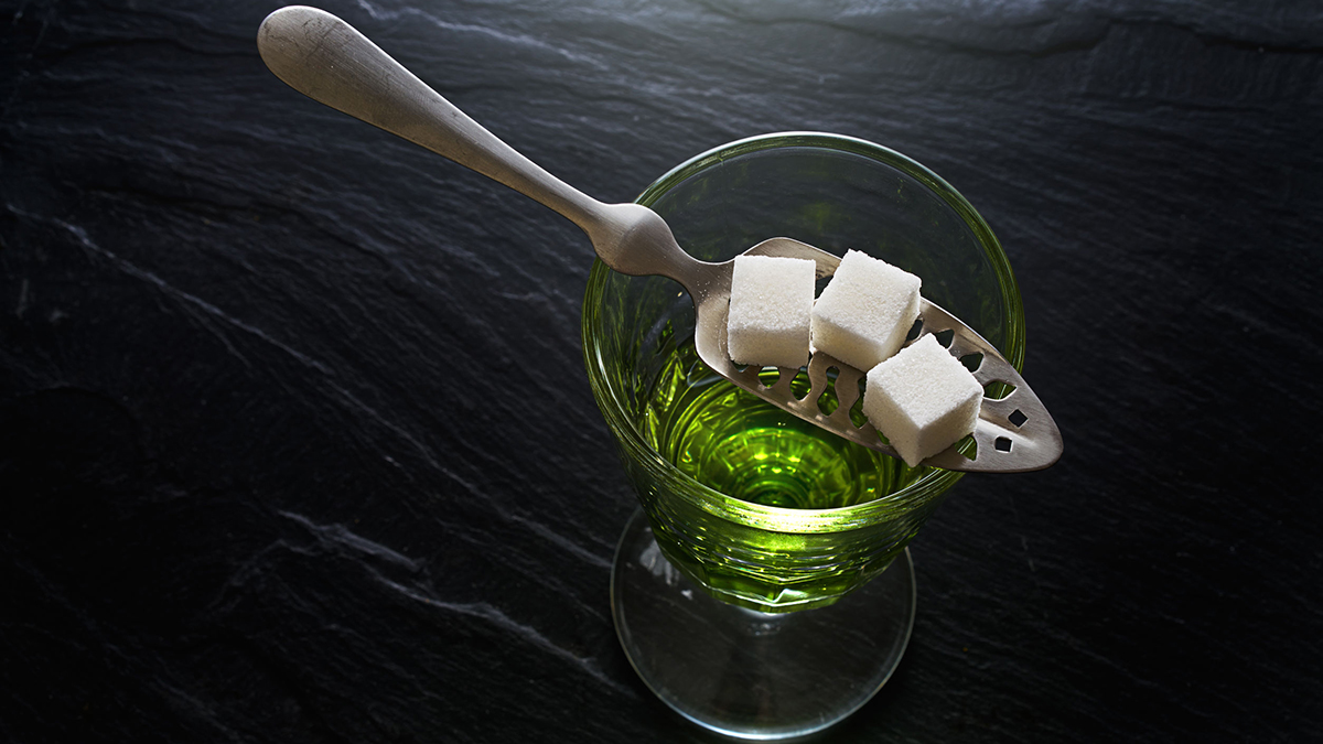Absinthe with sugar cubes and spoon