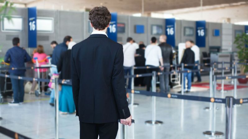Person about to get in line at the airport.