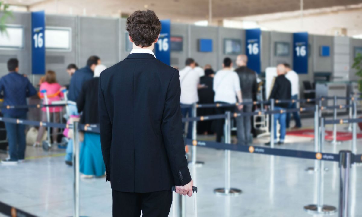 Person about to get in line at the airport.