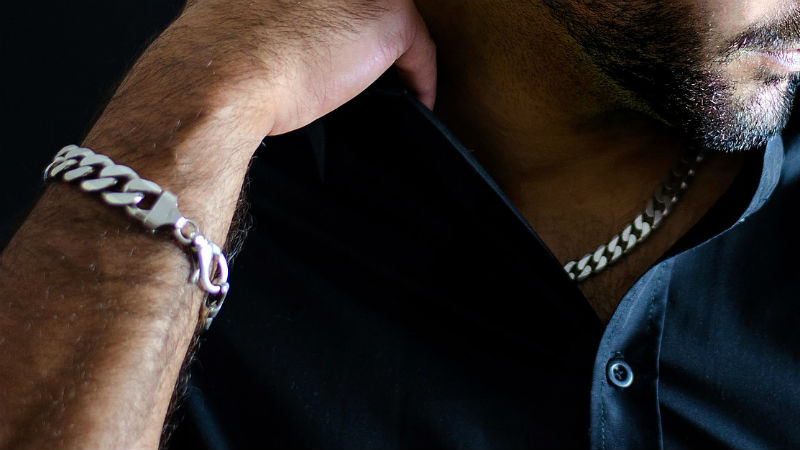 Man wearing bracelet and necklace