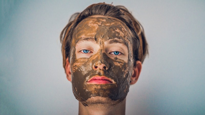manly spa treatments for new years eve man with mud mask