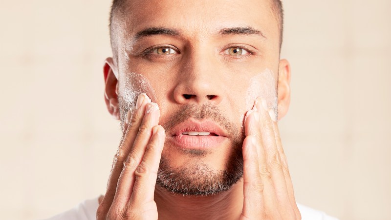 Man using skincare products