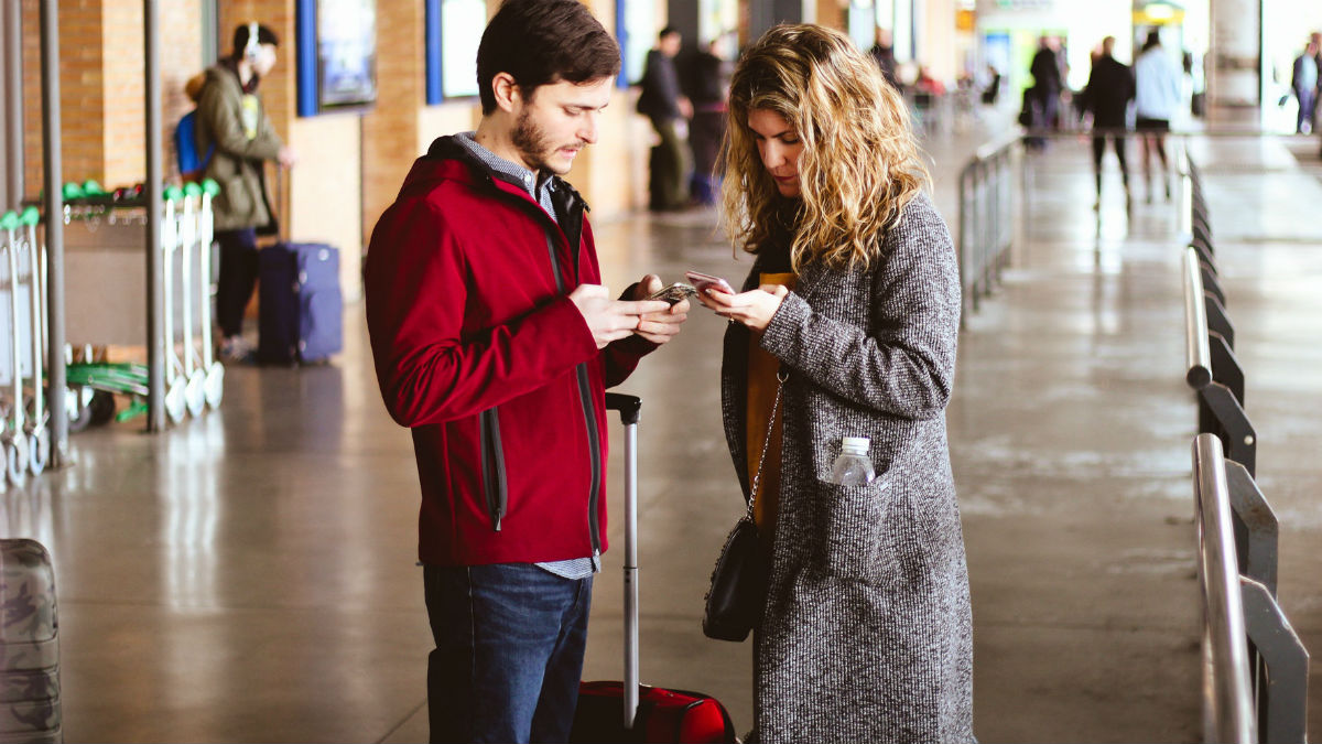 airport air travel couple suitcase