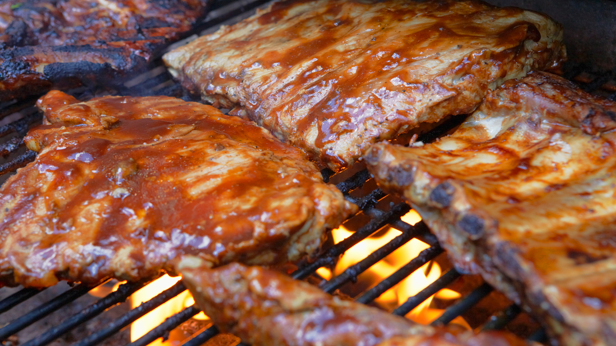 Mustard bbq sauce on ribs.