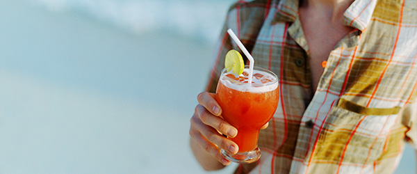 Holding a Cinco de Mayo drink