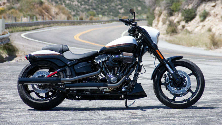 Side profile of 2016 CVO Pro Street Breakout parked on the side of a windy road.