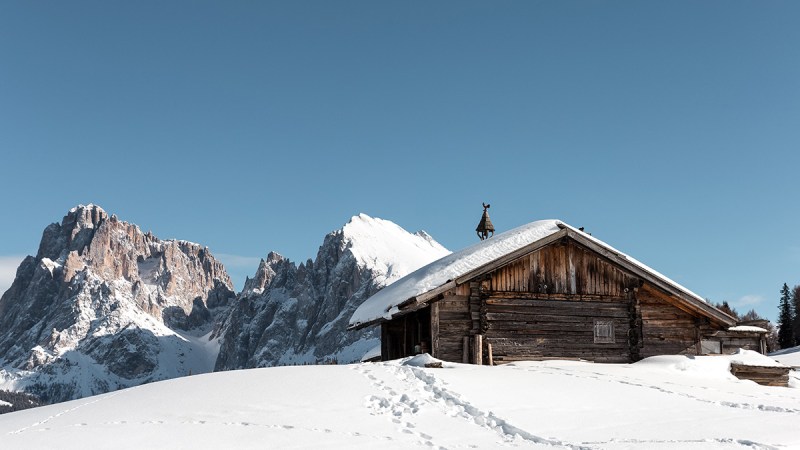 cabin on snowy hillside