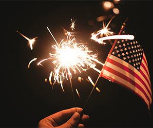 Fourth of July sparkler and flag