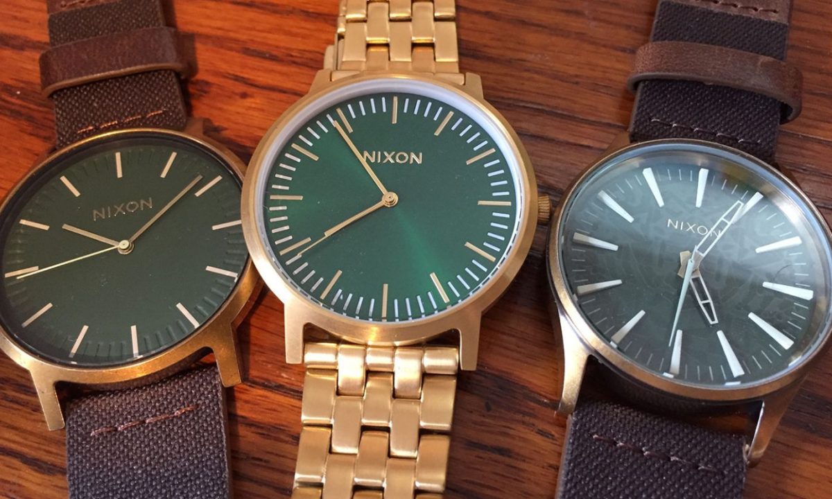 Three various Nixon watches.