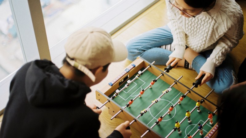 Two playing a game together on a date.