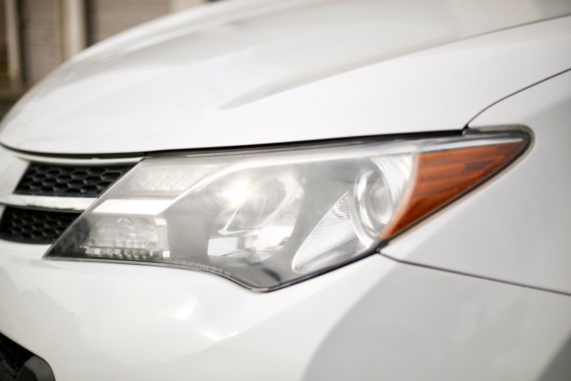 Foggy headlight on Toyota RAV4 from driver's side.