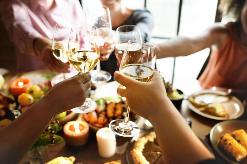 Group of friends having a toast with wine.