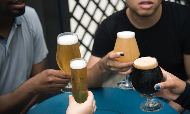 A group of friends enjoying their glasses of craft beer.
