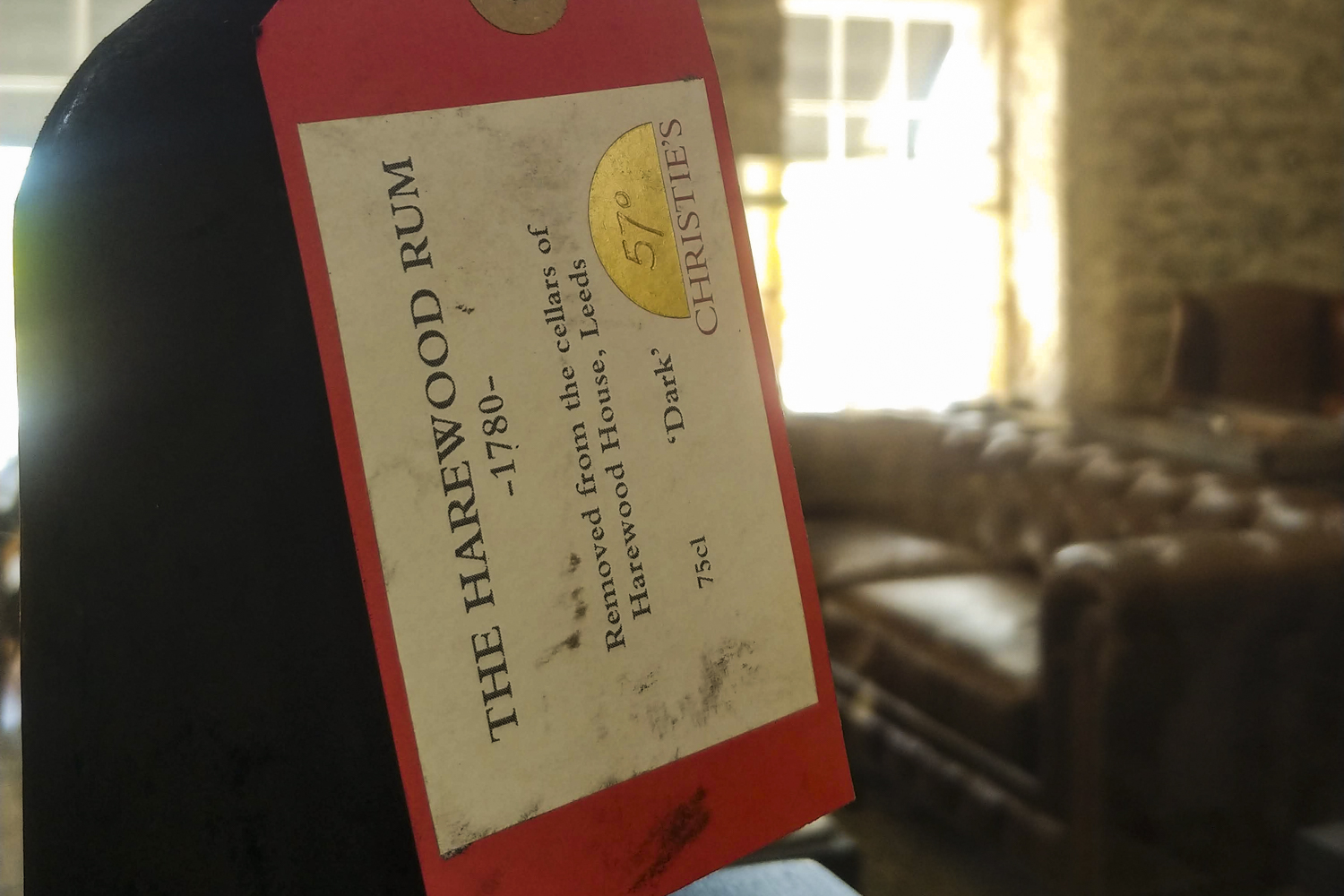 barbados bars restaurants distlleries guide rare bottle of rum behind glass at mount gay distillery 9