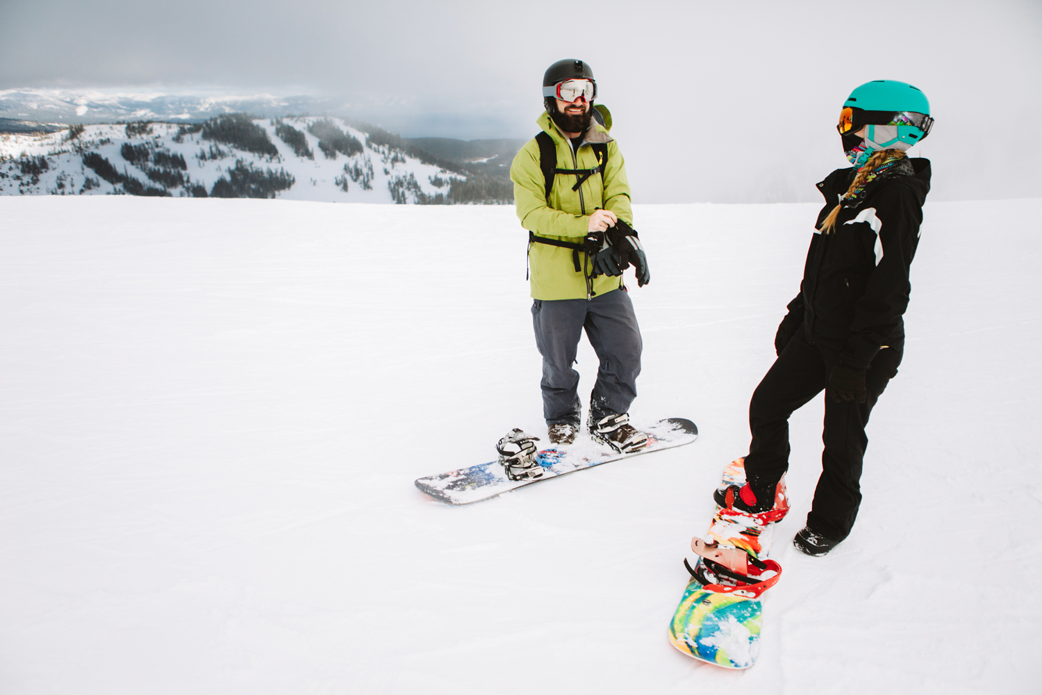 couple on snowboards.