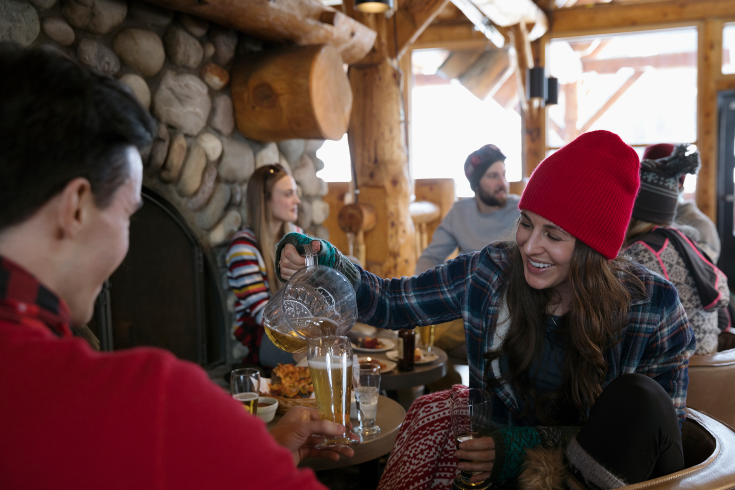 Friend enjoying après ski in a ski lodge