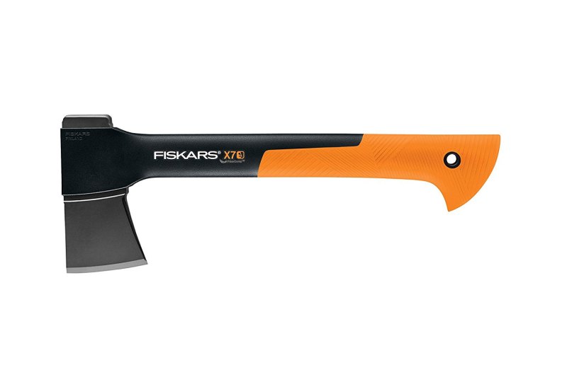 A black and orange Fiskars X7 hatchet on a white background.