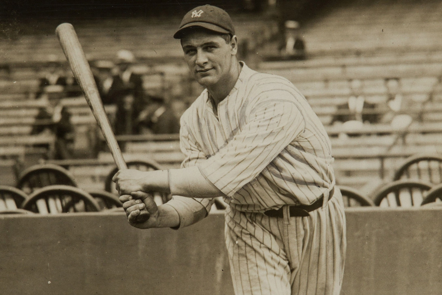 Lou Gehrig swinging a baseball bat.