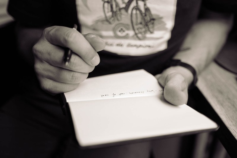 Man writing in a journal