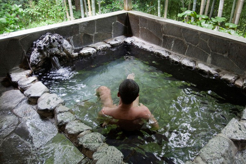 Man relaxing by himself in a Japanese onsen