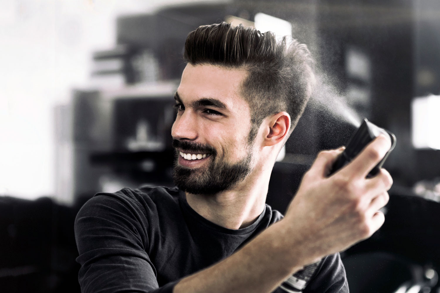 Man spraying hair