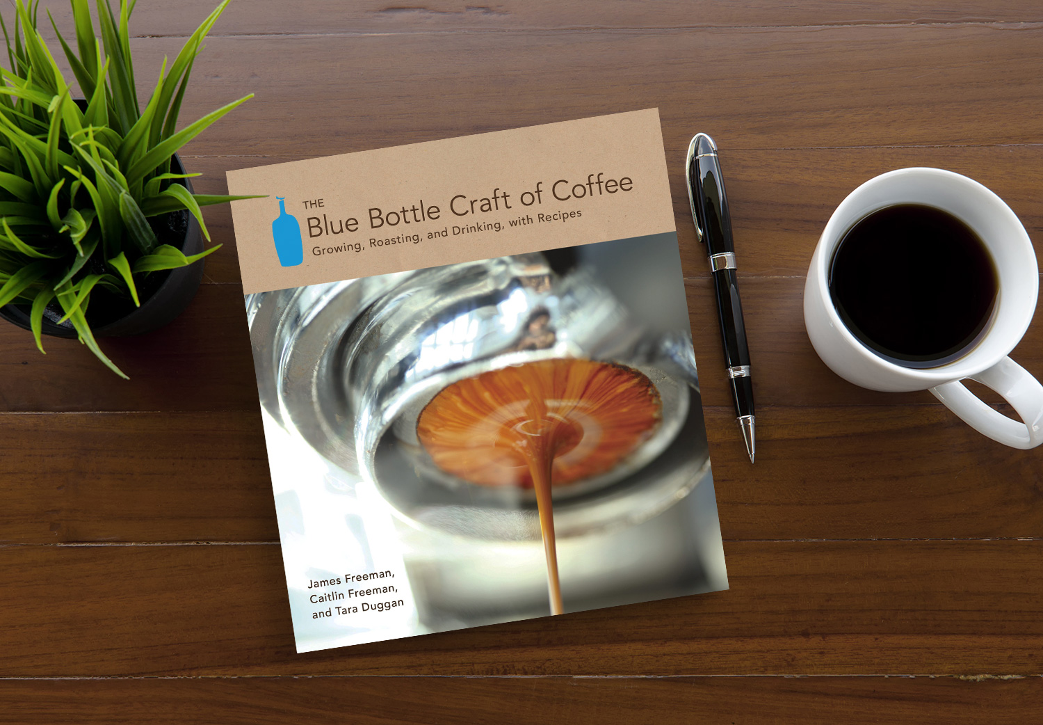 The Blue Bottle Craft of Coffee by James Freeman on a wooden table.