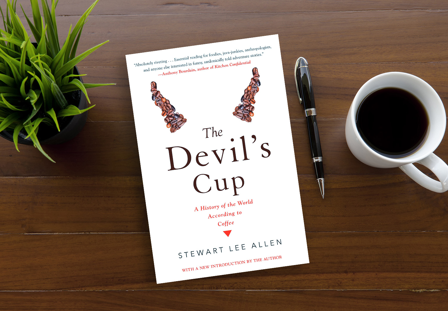 The Devil’s Cup by Stewart Lee Allen on a wooden table.