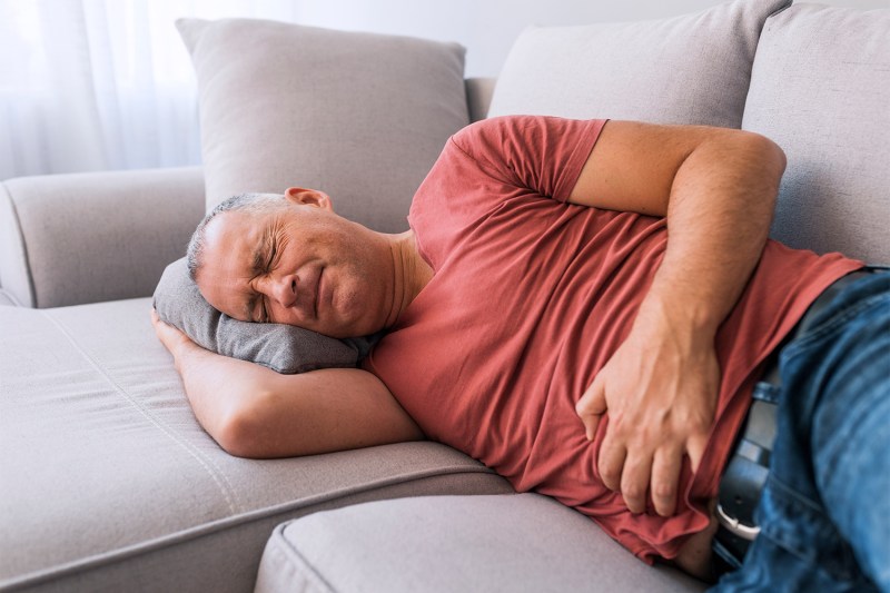 Man in pain on the couch