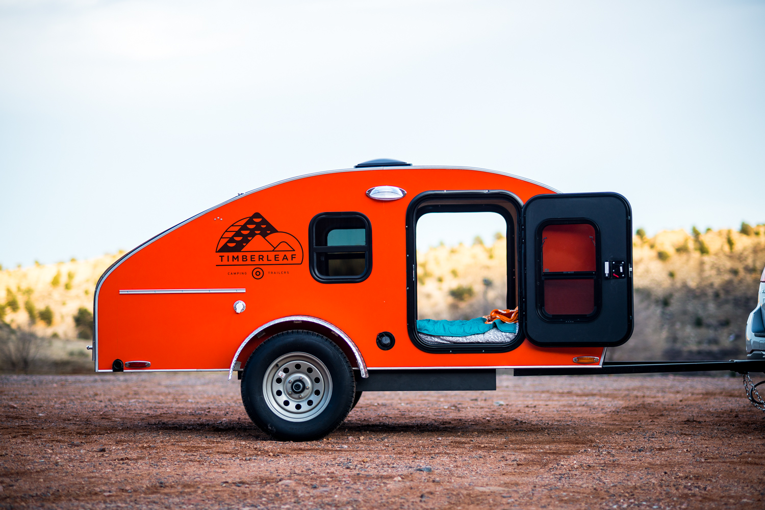 Timberleaf Teardrop Trailer against an outdoor background scene.