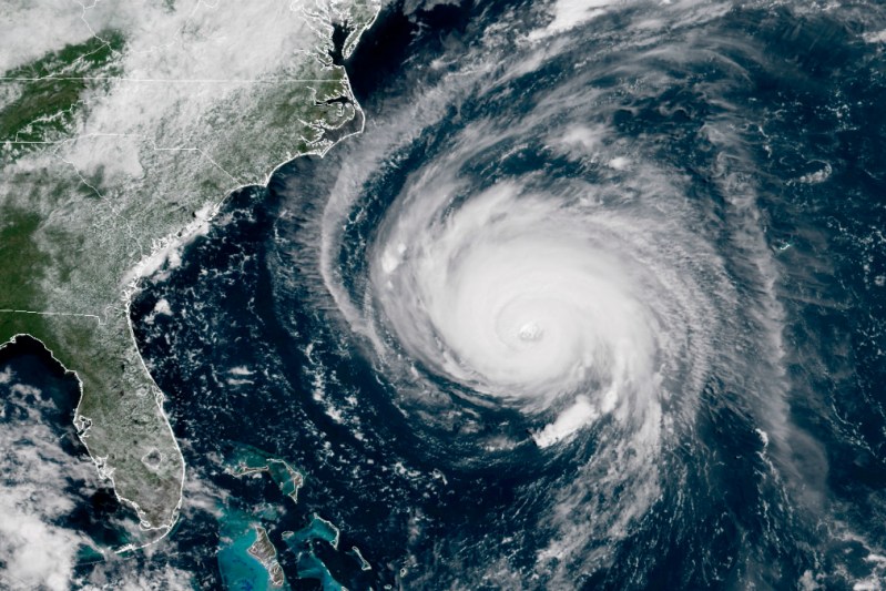 Hurricane Florence Bears Down on U.S. East Coast IN SPACE - SEPTEMBER 12: In this satellite image provided by U.S. National Oceanic and Atmospheric Administration (NOAA), Hurricane Florence churns through the Atlantic Ocean toward the U.S. East Coast on September 12, 2018. Florence slowed its approach to the U.S. today and was forecast to turn south, stalling along the North Carolina and South Carolina coast and bringing with it torrential rain, high winds and a dangerous storm surge tomorrow through Saturday. (Photo by NOAA via Getty Images)