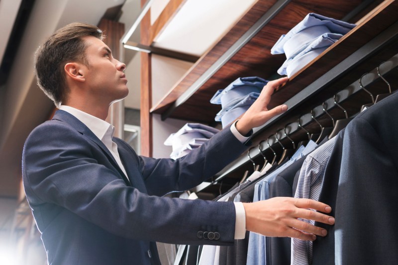 Man buying a suit in a store