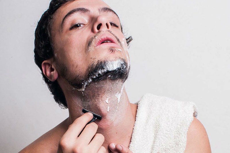 Man shaving his neck